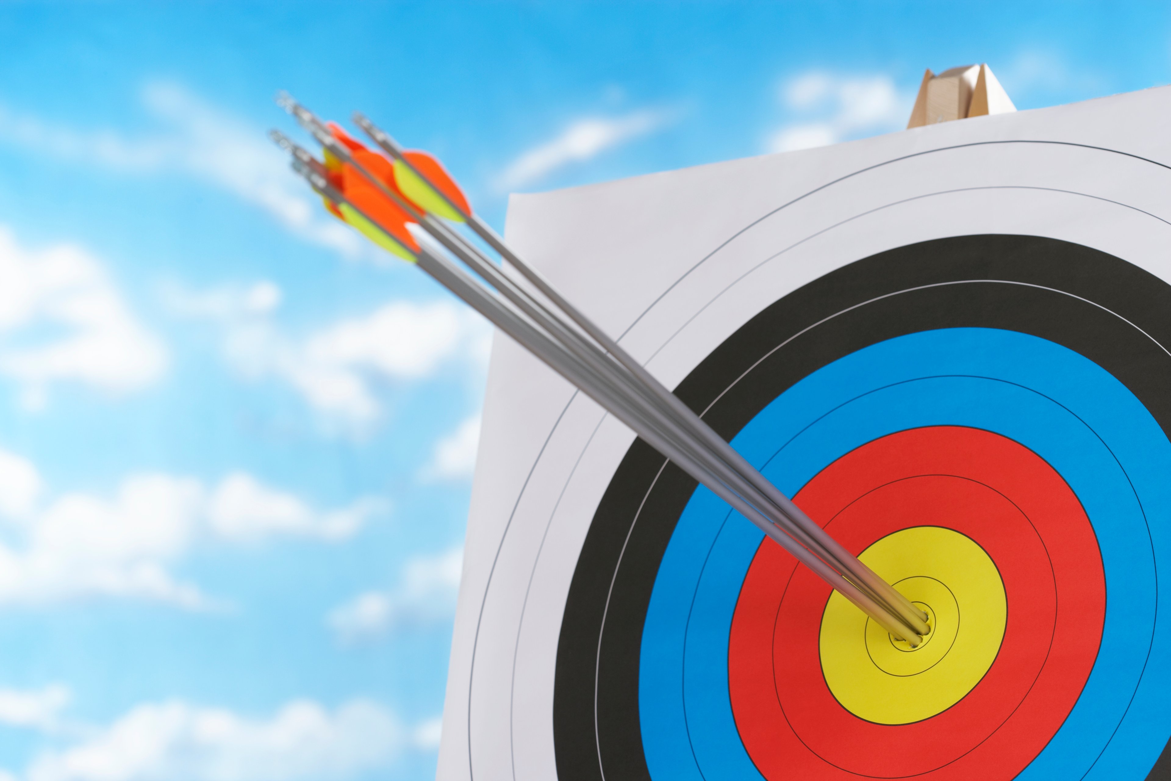 Three arrows in the bulls eye of a target.