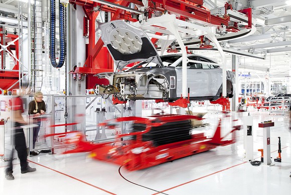Vehicle being assembled in Tesla's factory.