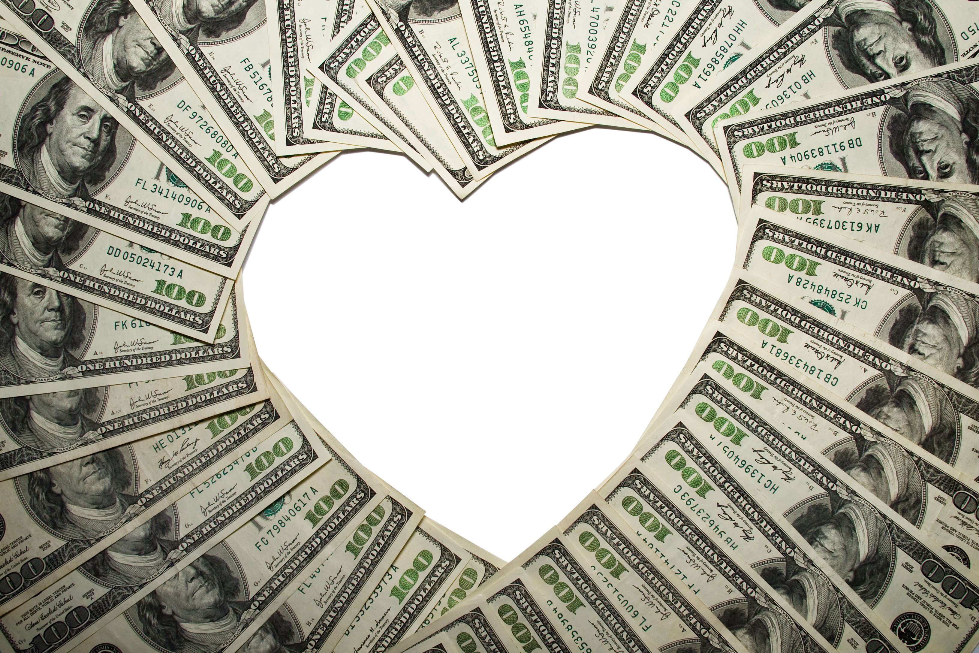 Hundred dollar bills fanned out to form a heart shape in their center.