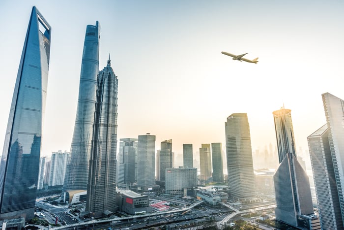 A plane flying over Shanghai