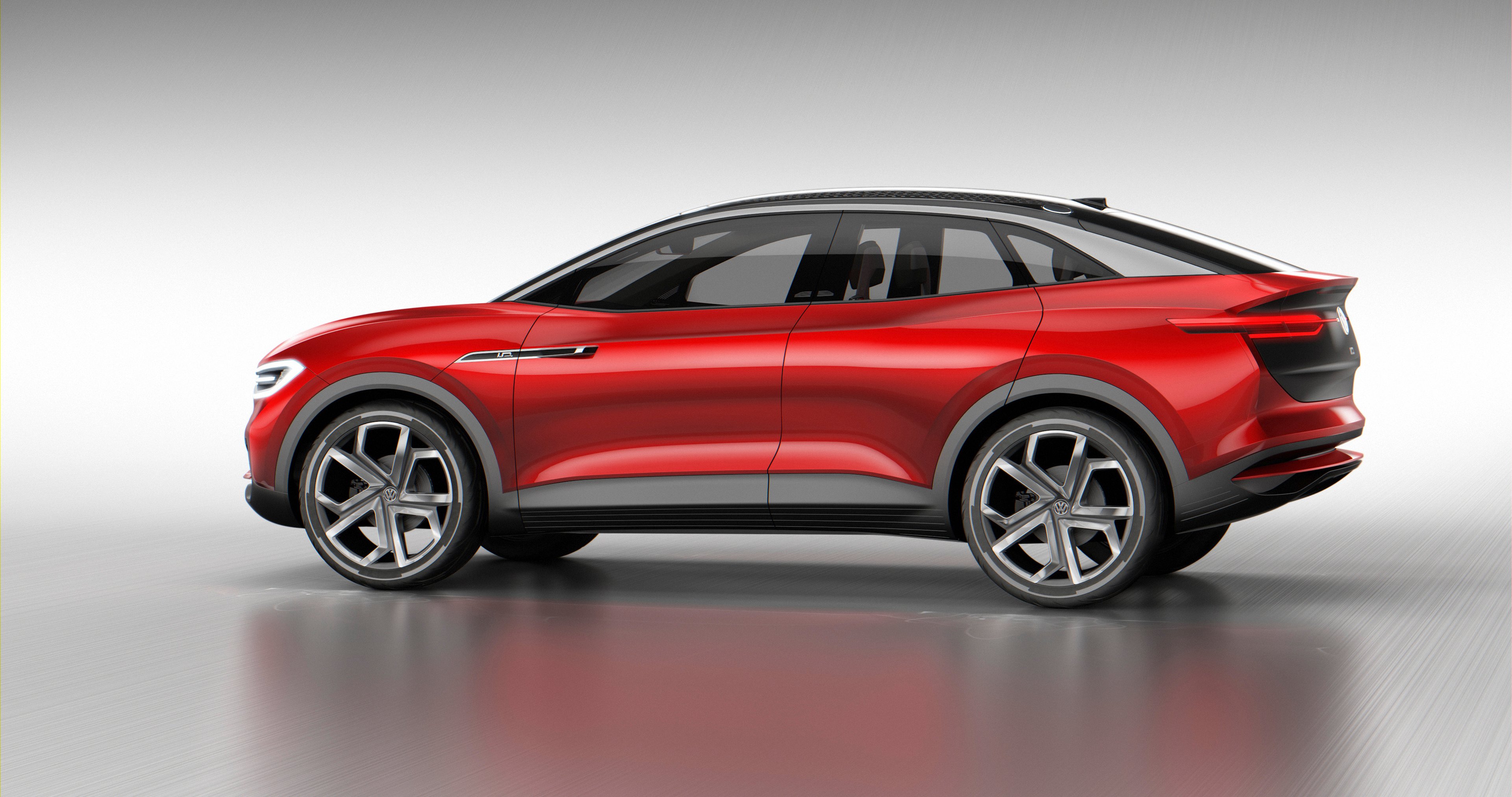 The Volkswagen I.D. Crozz II Concept, a red crossover SUV with a curved roof. 