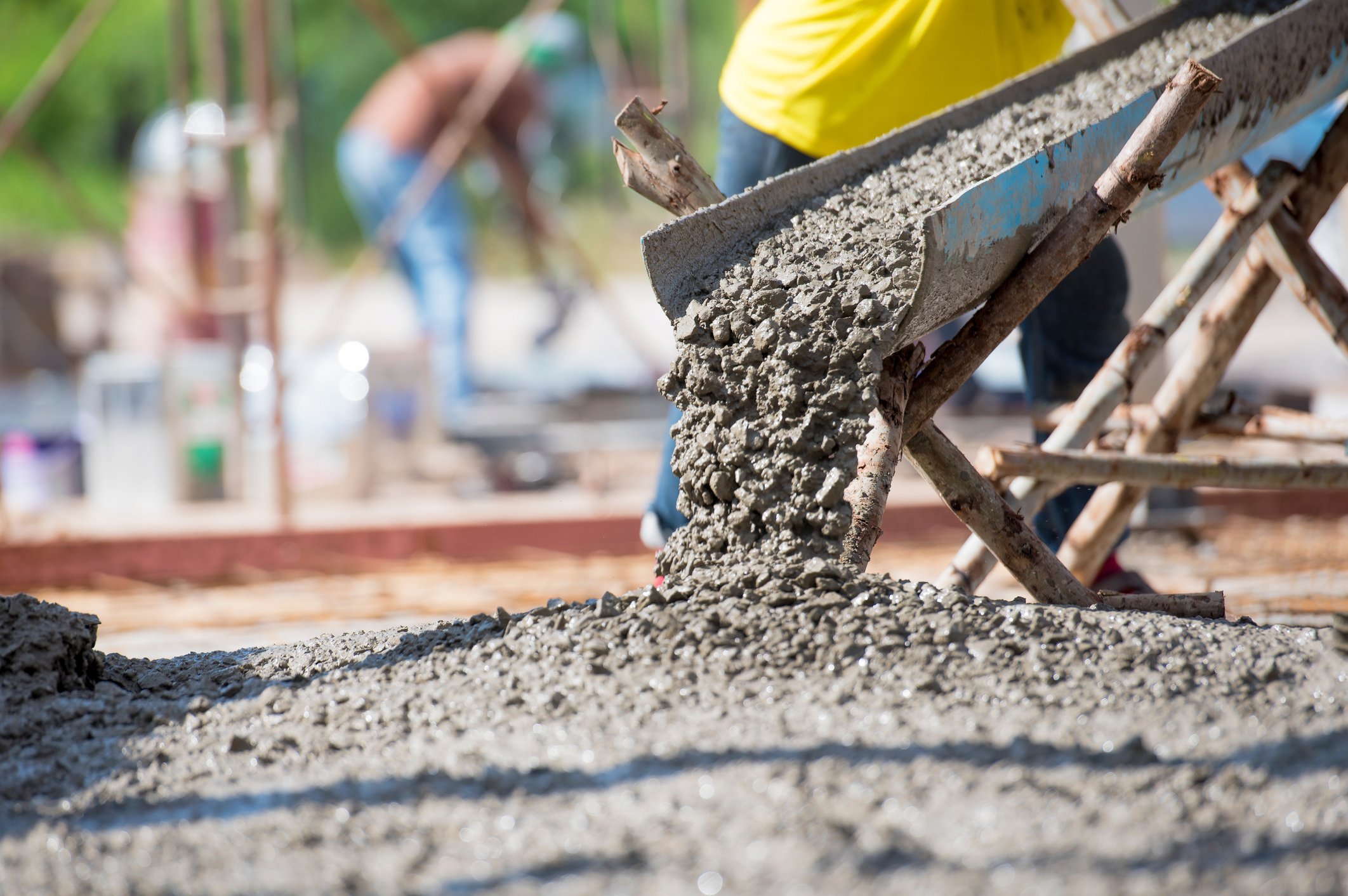 Concrete flowing down a chute during construction.