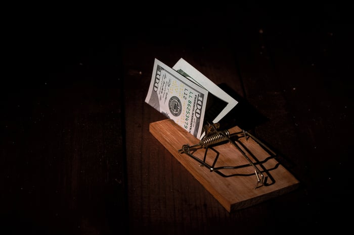 A mouse trap with $100 bill as bait.