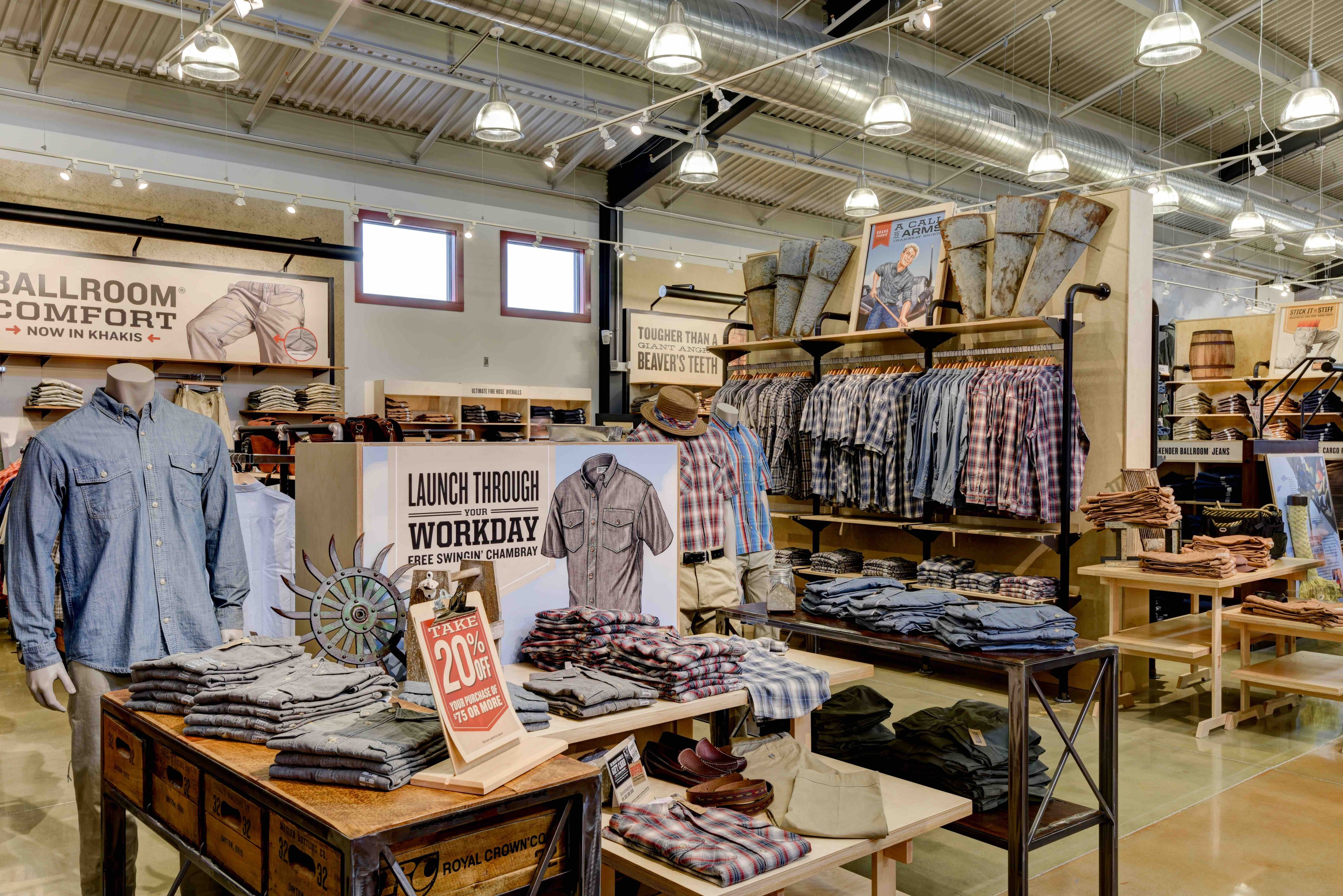Inside view of a Duluth Trading men's department, with button-down shirts on display.