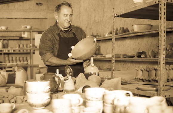 Man in a pottery shop.