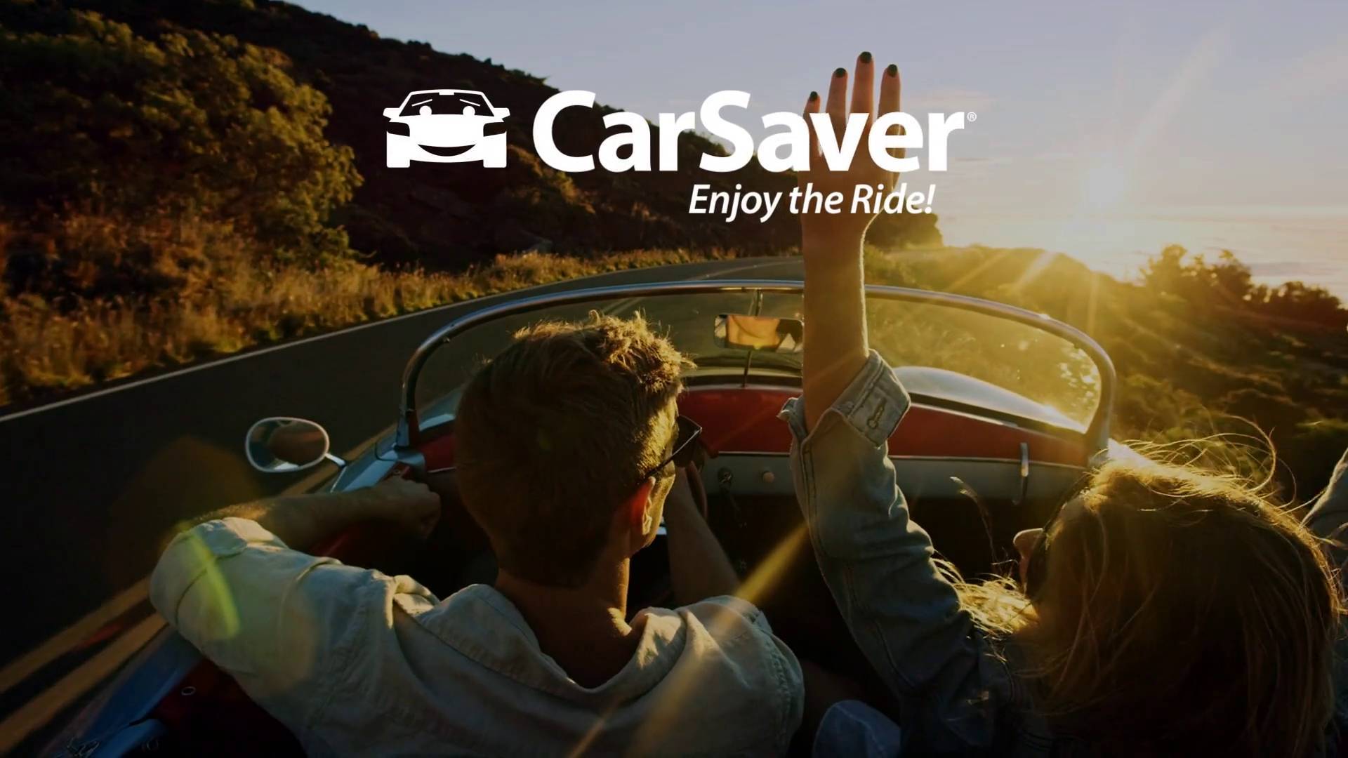 Man and woman driving in a convertible