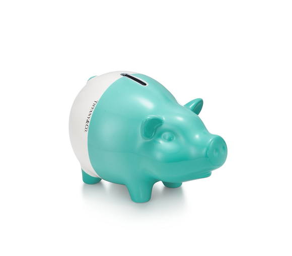A white and green piggy bank.