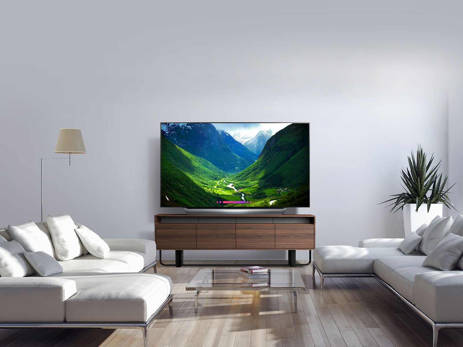 A modern living room with a big screen LG OLED TV on an entertainment stand.