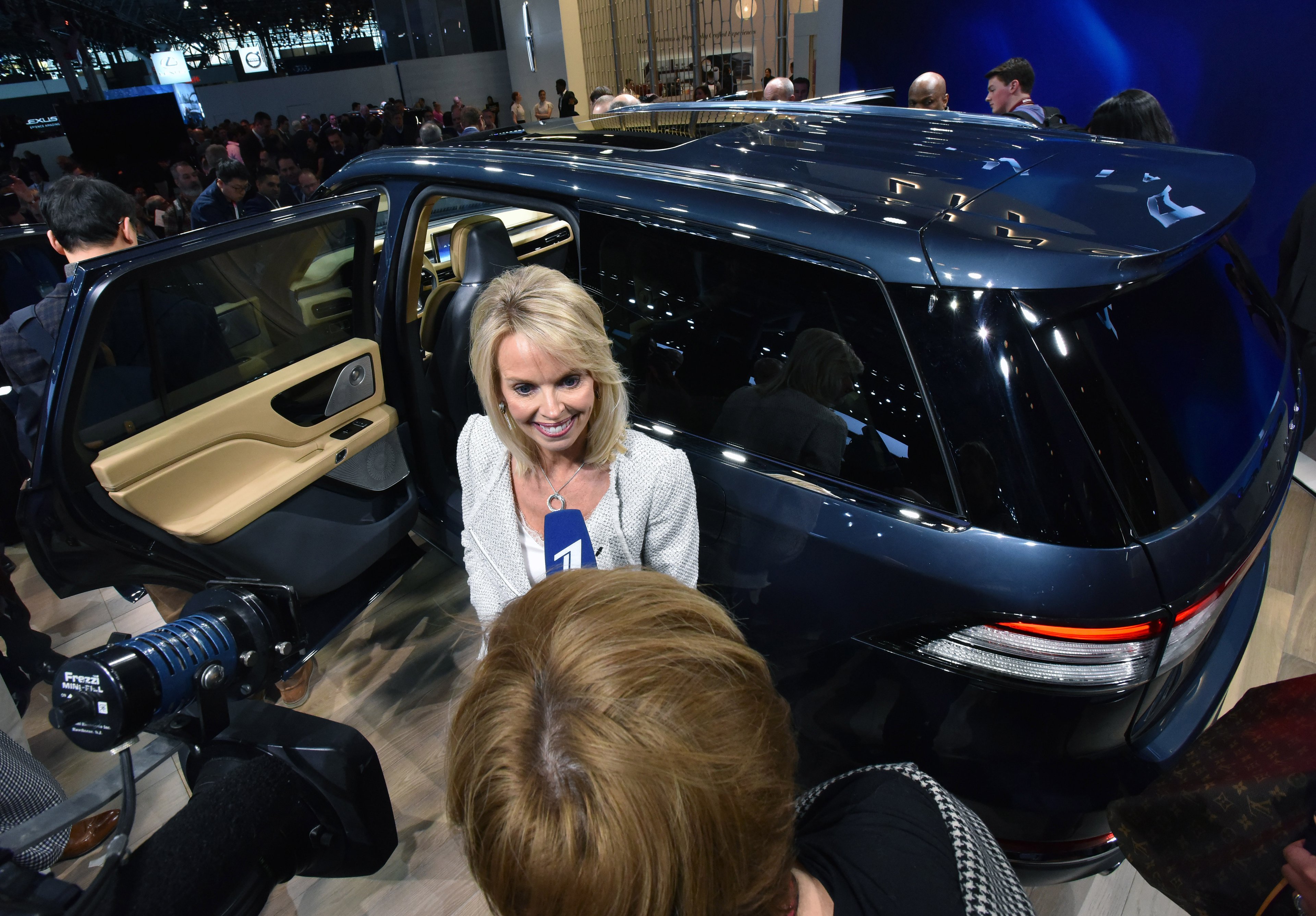 Falotico is shown standing in front of the all-new Lincoln Aviator as she is interviewed by a journalist. 