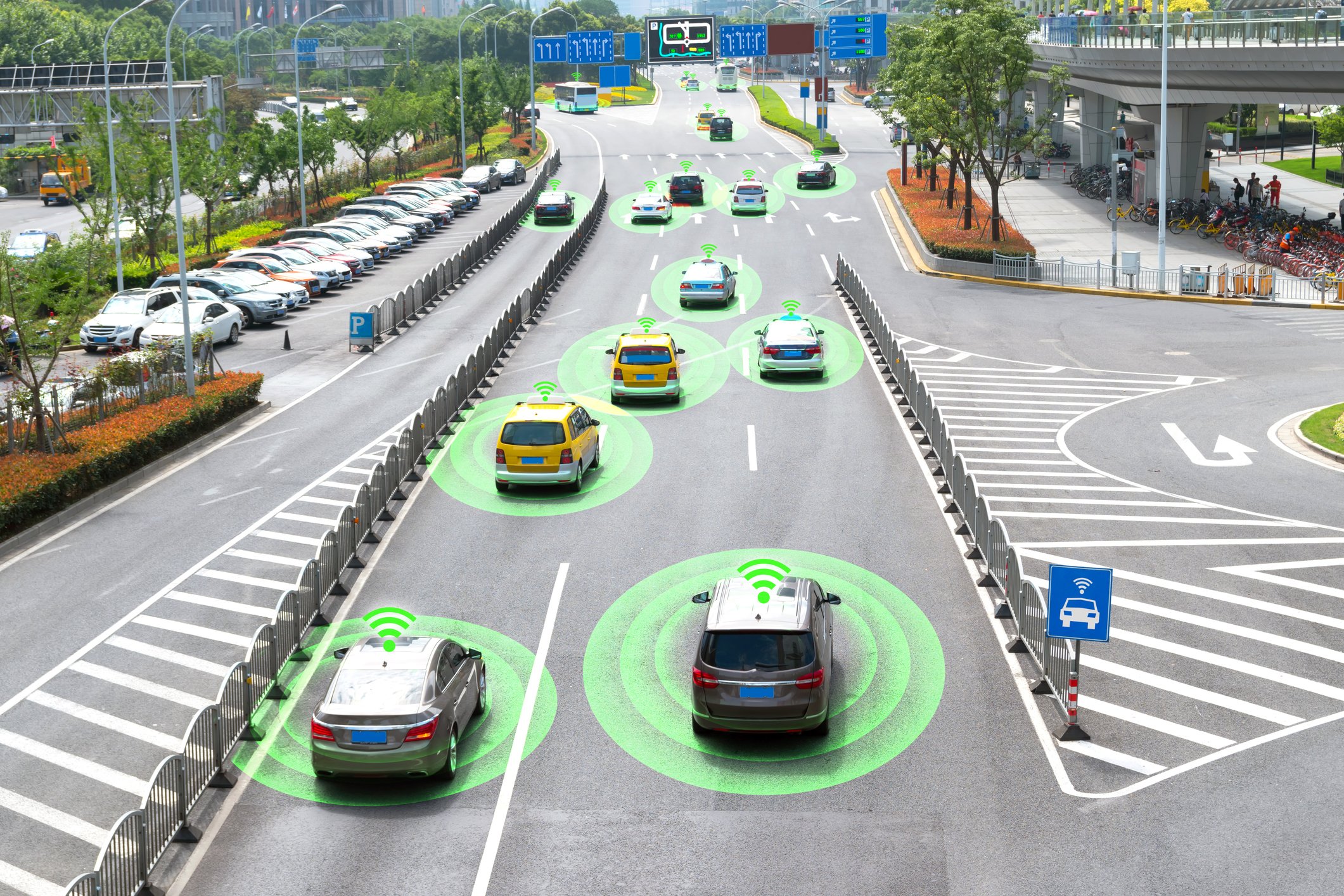 Cars on a road with green circles around them.