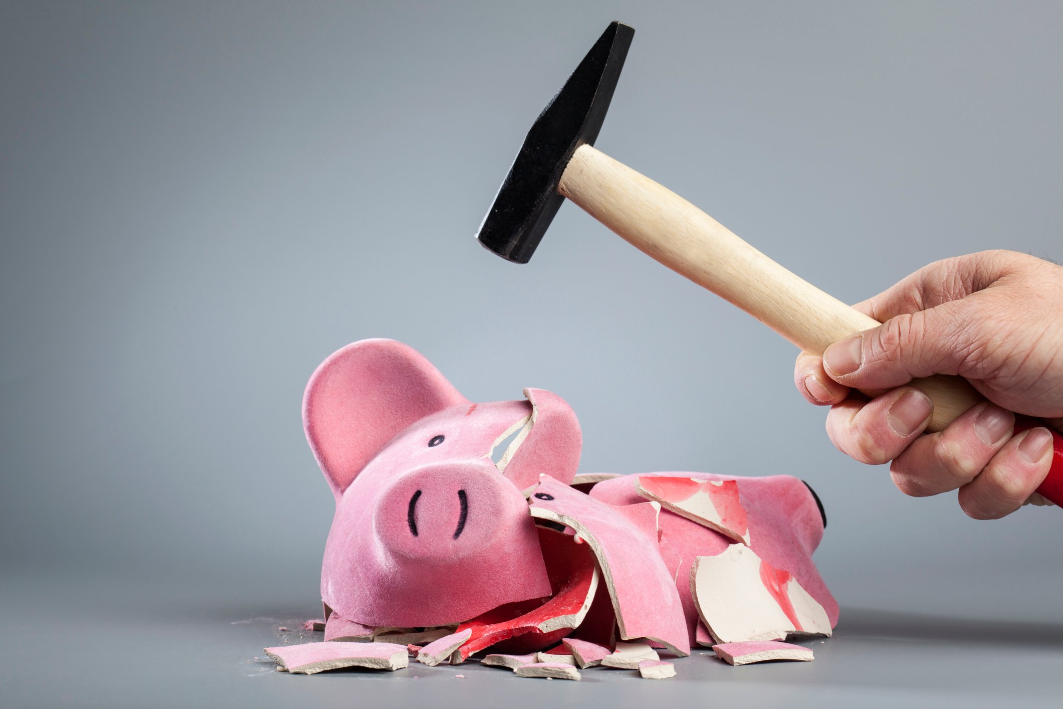 Getty Piggy Bank Broken with Hammer