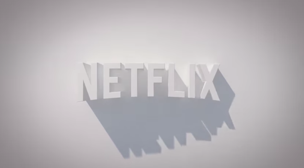 A 3D rendering of the Netflix logo, casting oblique shadows on a gray background.