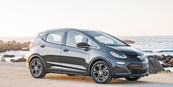 A 2018 Chevrolet Bolt EV parked on a beach.