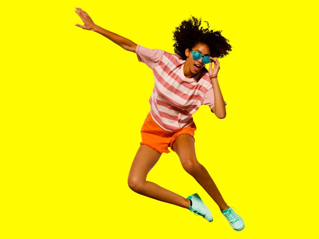 A woman wearing Snap's Spectacles.