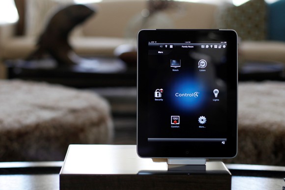 A Control4 tablet in a living room.