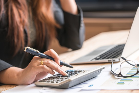 Woman using a calculator.