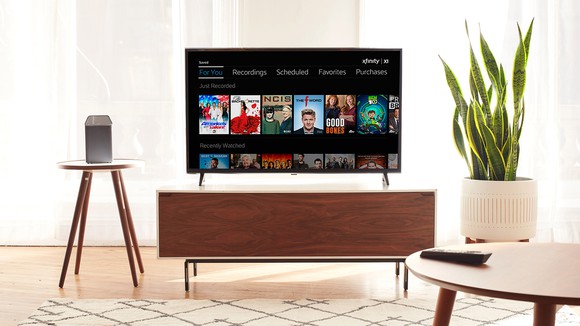 A TV in living room displaying Comcast Xfinity platform.