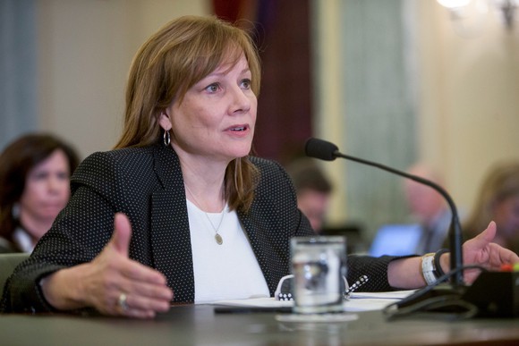 GM CEO Mary Barra is shown seated at a table in a U.S. Senate conference chamber. 