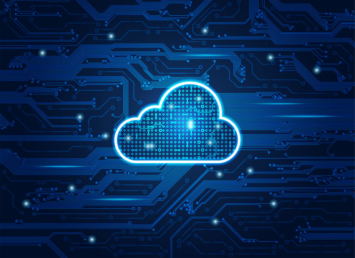 Cloud shape superimposed over computer circuitry.