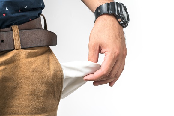 Person pulling out an empty pocket.