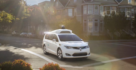 Image of a minivan in an intersection.