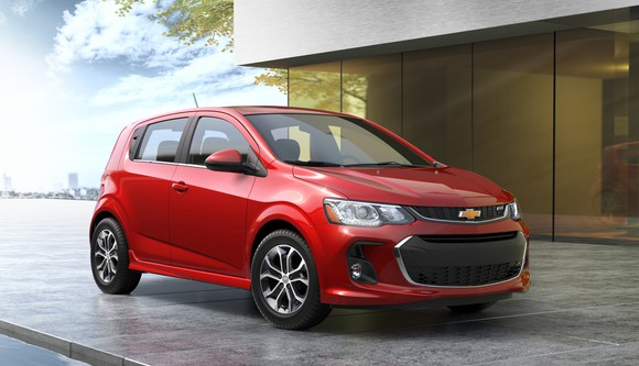 A red 2018 Chevrolet Sonic, a subcompact hatchback.