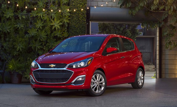 A red 2019 Chevrolet Spark, a very small hatchback. 
