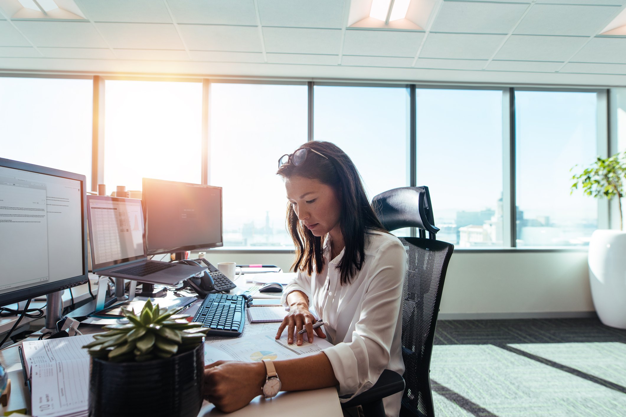 Woman working at a desk.
