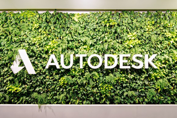 Autodesk logo and sign surrounded by greenery.