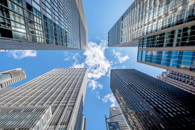 Looking up at skyscrapers
