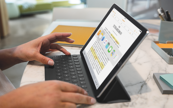 Person using iPad Pro and Smart Keyboard