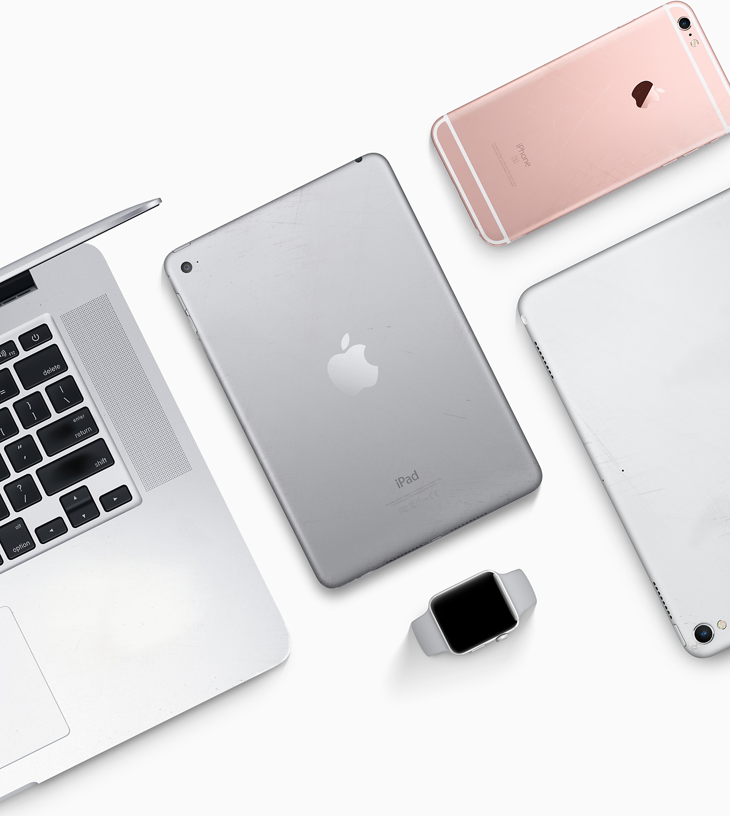 An assortment of Apple devices including the iPad, iPhone, Apple Watch, and Mac.