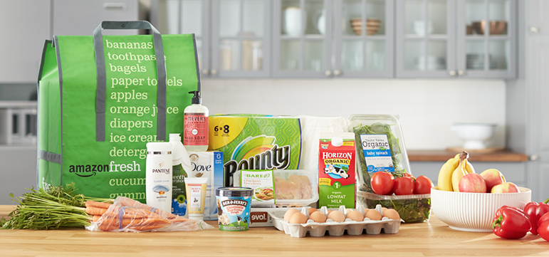 An AmazonFesh grocery order on a kitchen counter.