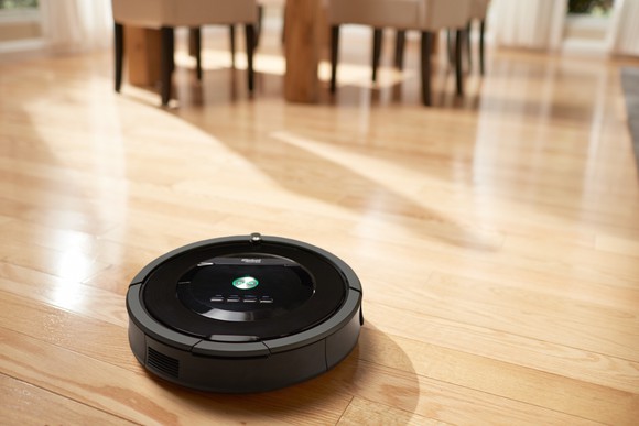 Roomba cleaning a hardwood floor
