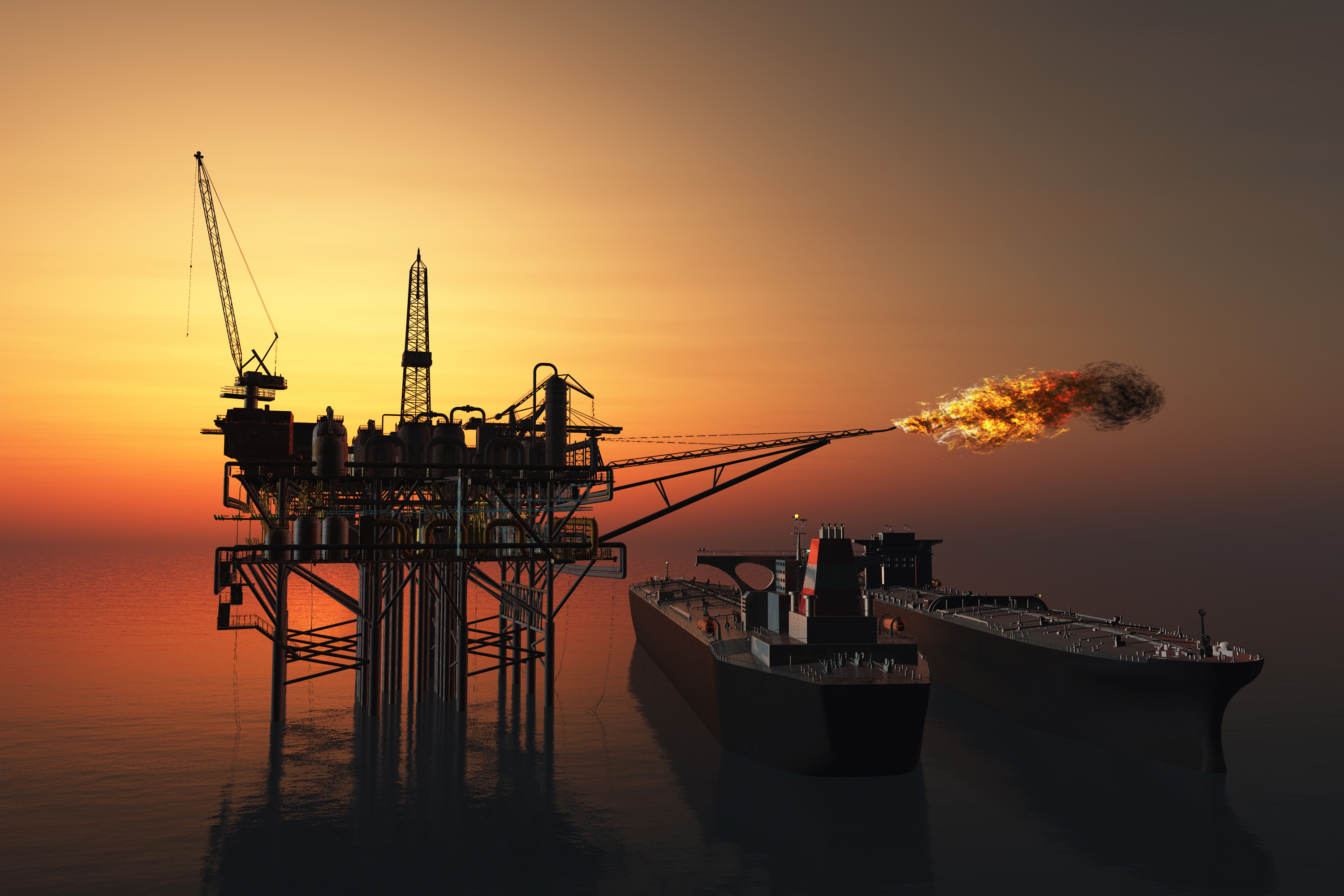 Offshore oil and gas vessels at sunset.
