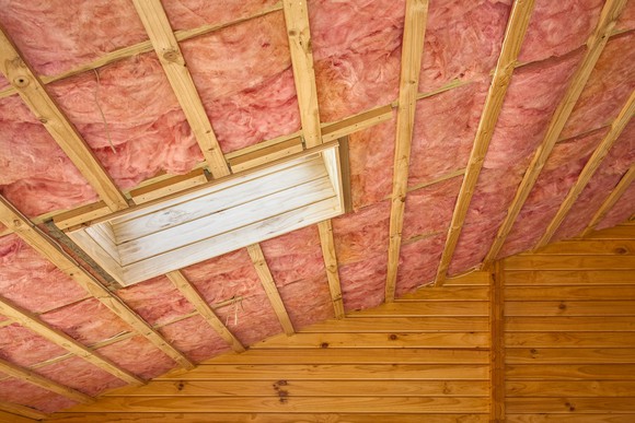 Pink insulation on the inside of a roof.