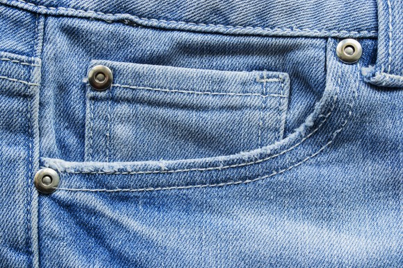 a closeup of a pocket on a pair of jeans. 