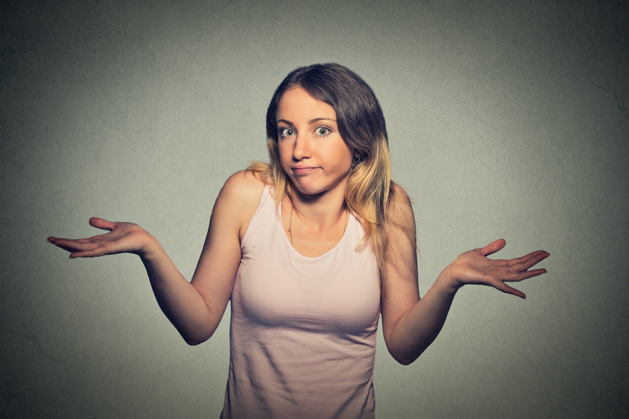 Young woman shrugging