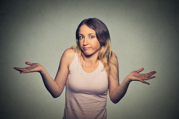 Young woman shrugging