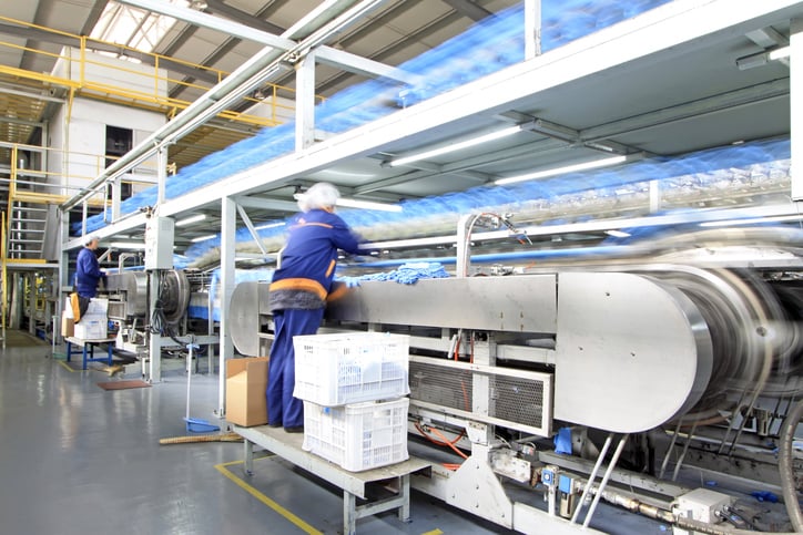 Workers on a food packaging line.