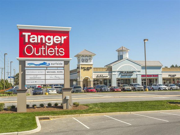 A Tanger Outlets Mall with sign in the foreground.