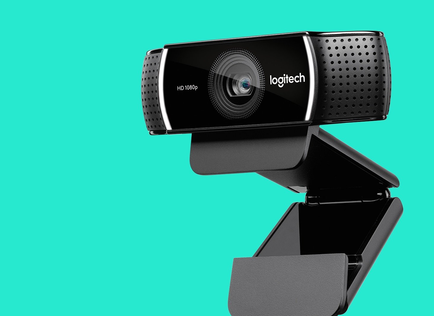 Webcam with Logitech logo against a teal background.
