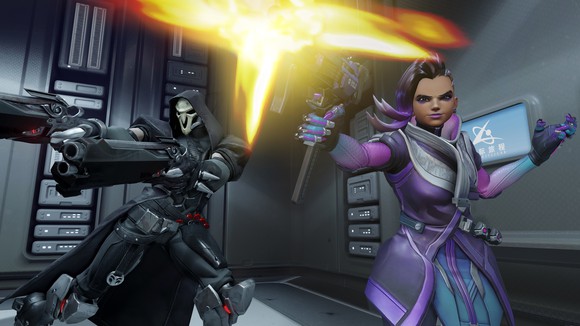 Reaper and Sombra, characters from Blizzard's Overwatch game, firing at an unseen assailant. 