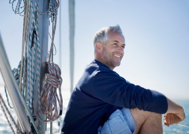 older man out on a boat_GettyImages-88621661