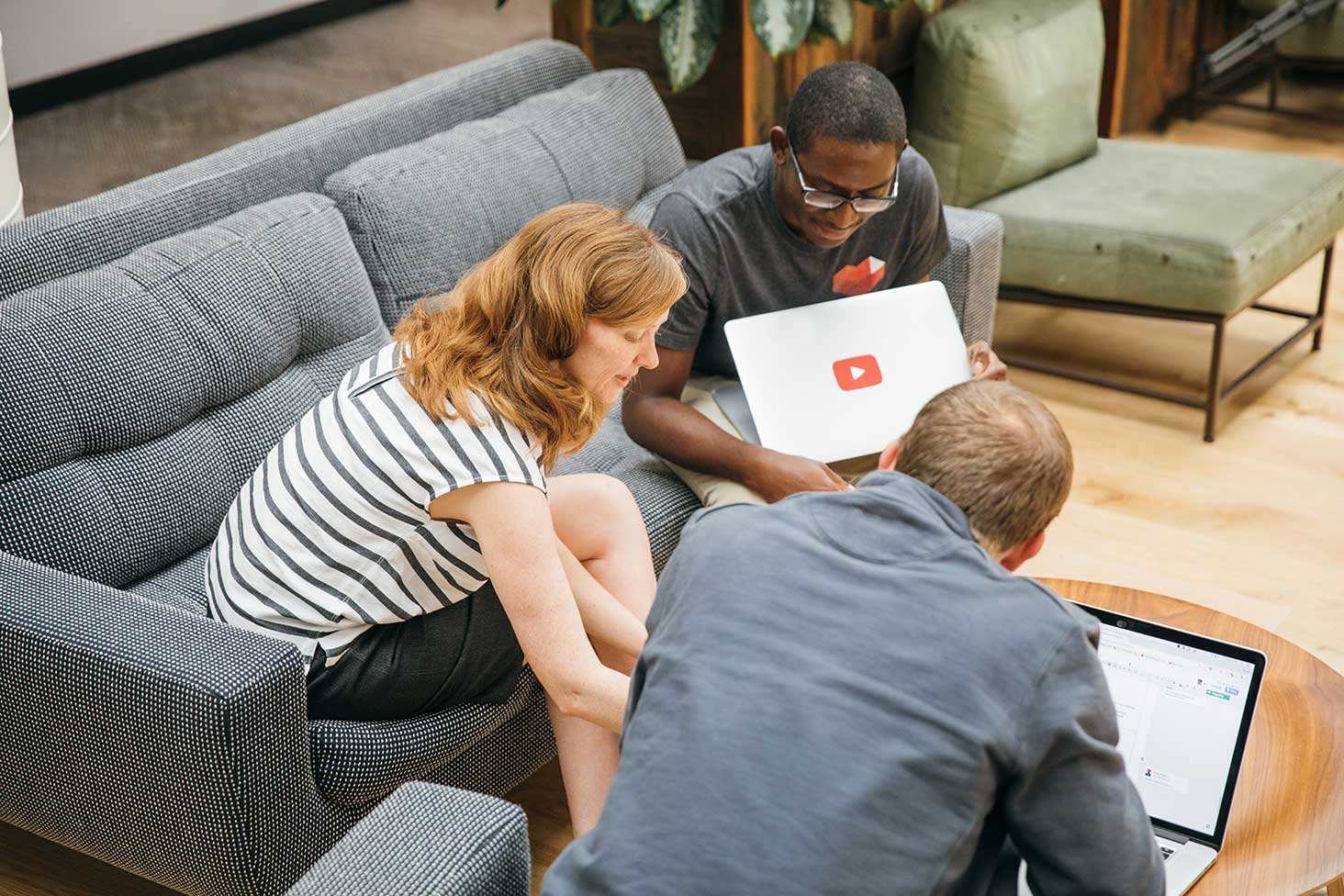 YouTube developers sitting on couches.