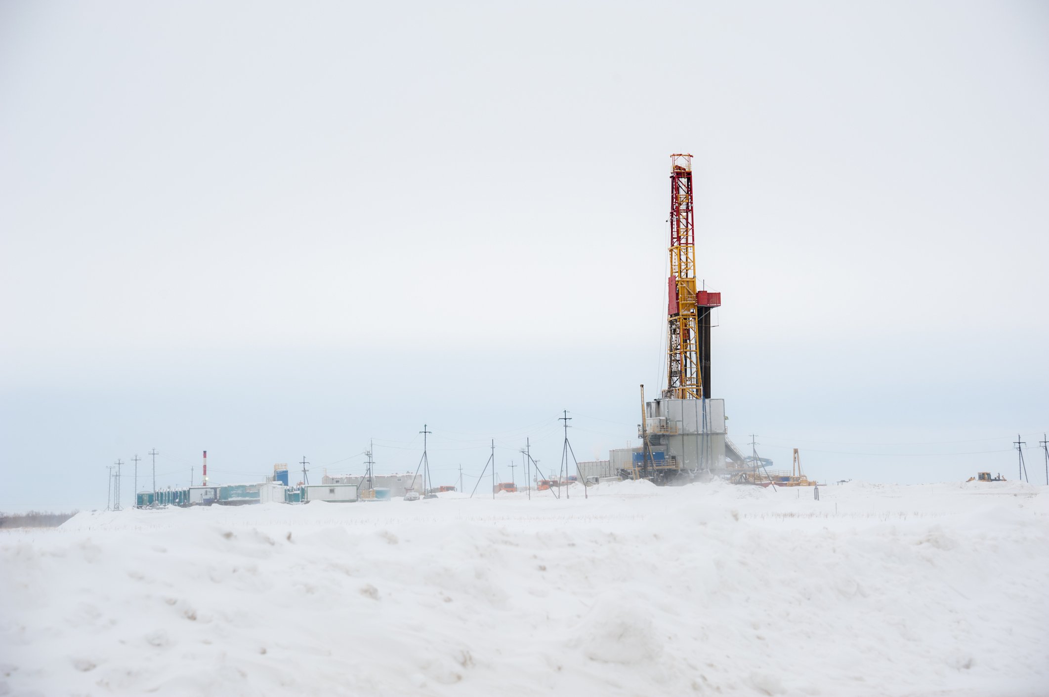 Drilling rig in winter, with snow covering the ground