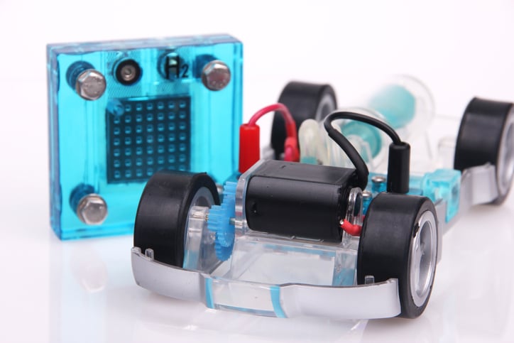 A lab scale fuel cell and a toy car.