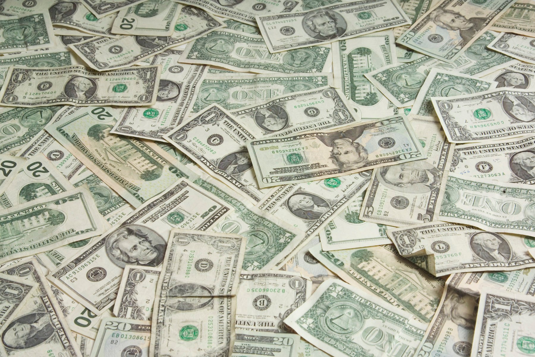 Image of a pile of U.S. bills.