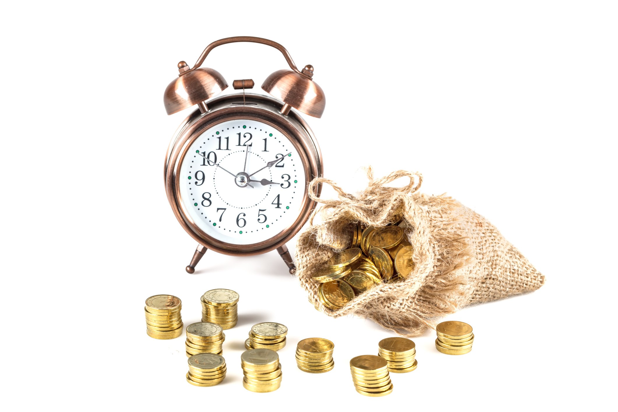 A clock next to a bag of gold coins.