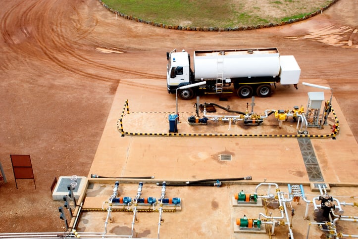 A truck refueling at a CNG refueling station.